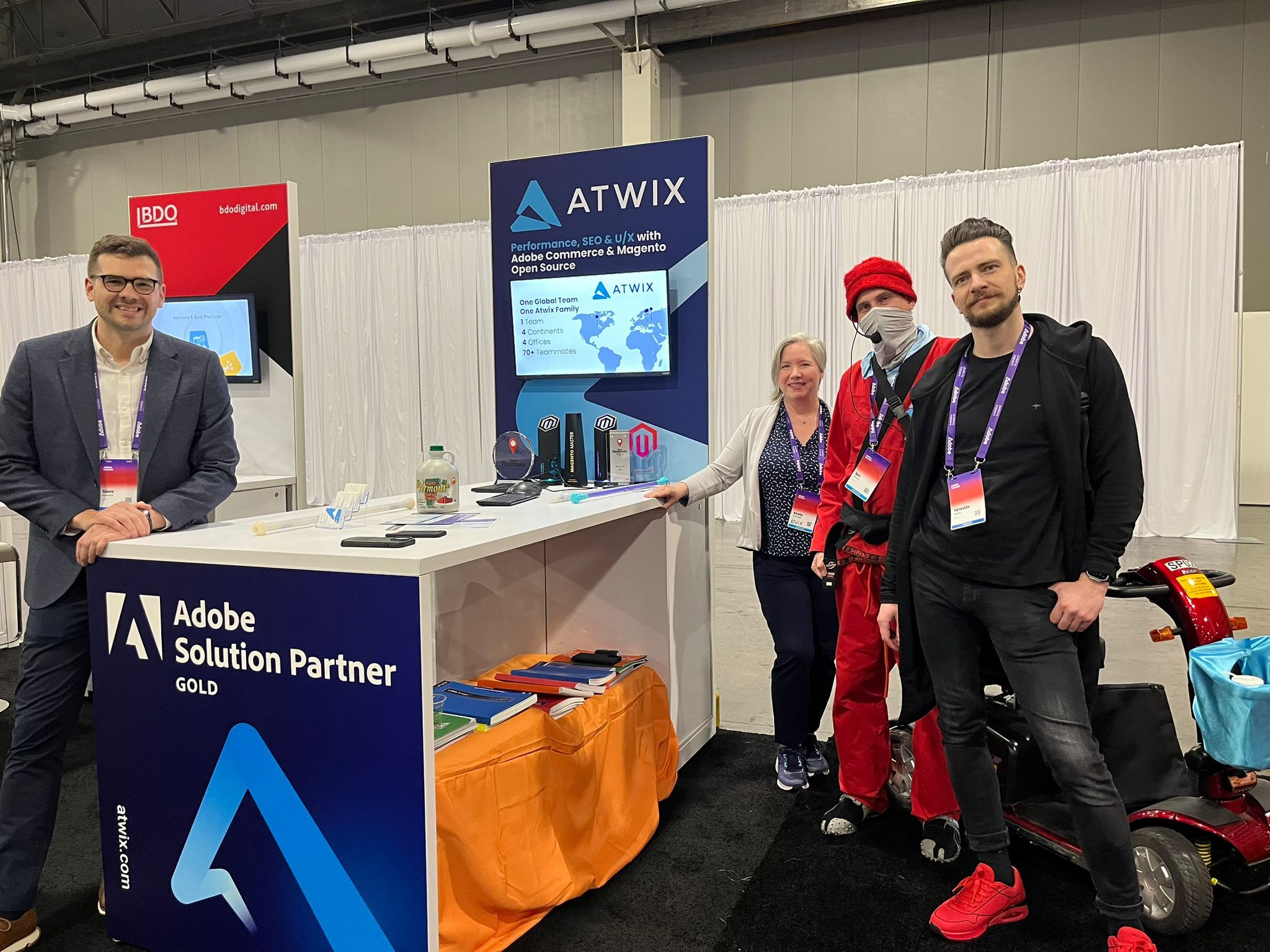 Atwix Team at Their Booth During Adobe Summit, Showcasing Their Partnership and Ecommerce Solutions.